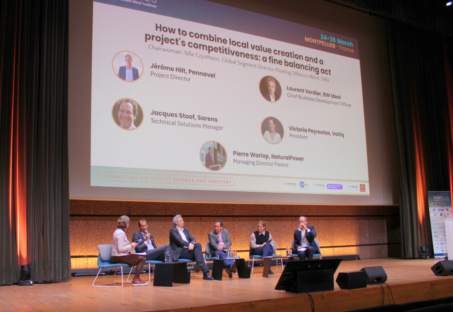 Intervention de Jerome Hilt lors de la plénière sur les enjeux de la création de valeur locale et la compétitivité des projets, soulignant l'importance de l'ancrage territorial pour la viabilité du secteur.